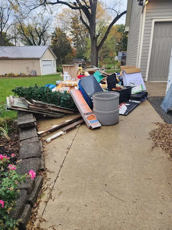 Dumpster being loaded with debris for 12 Yard Dumpster Rental in Las Flores